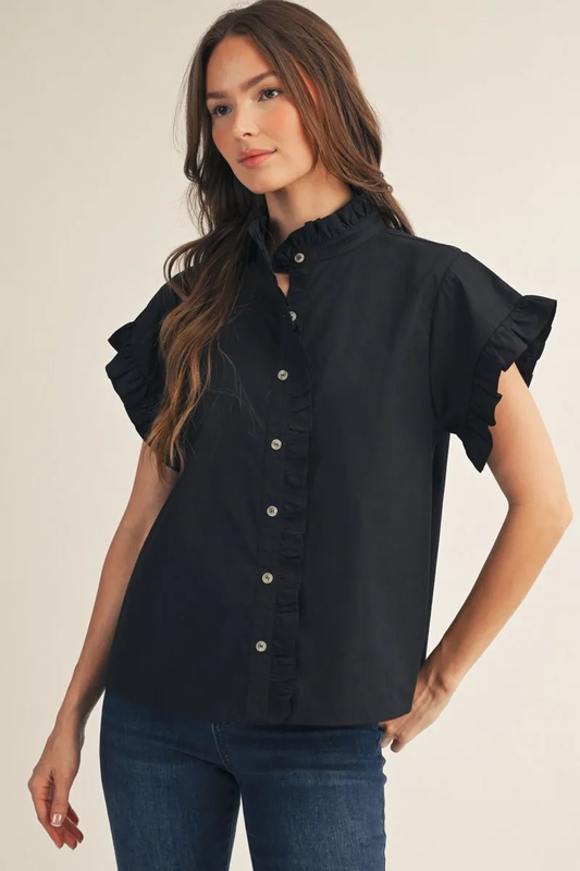 Model wearing a black drop-shoulder button-down top with ruffle sleeves and 100% cotton fabric